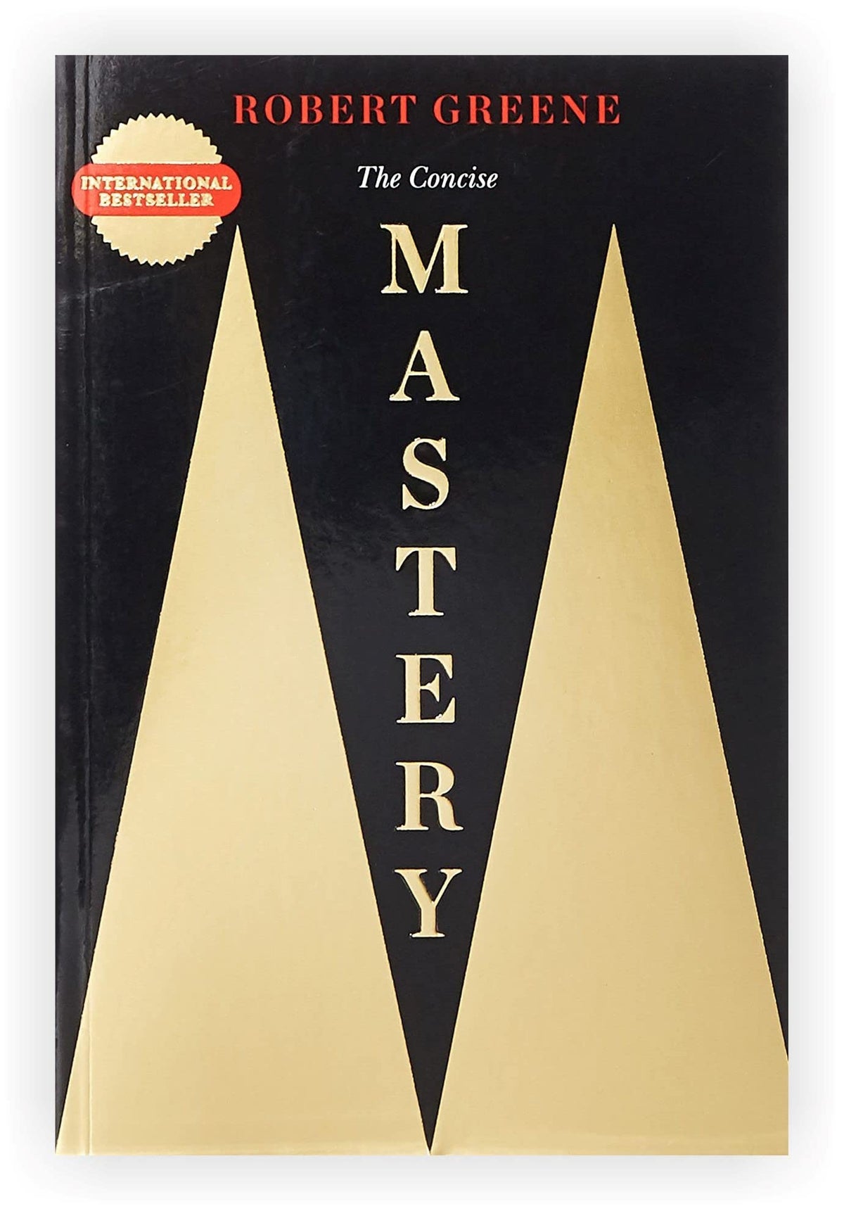 Close-up of the paperback spines for The Concise 48 Laws of Power, Laws of Human Nature, Mastery, Art of Seduction, and 33 Strategies of War.